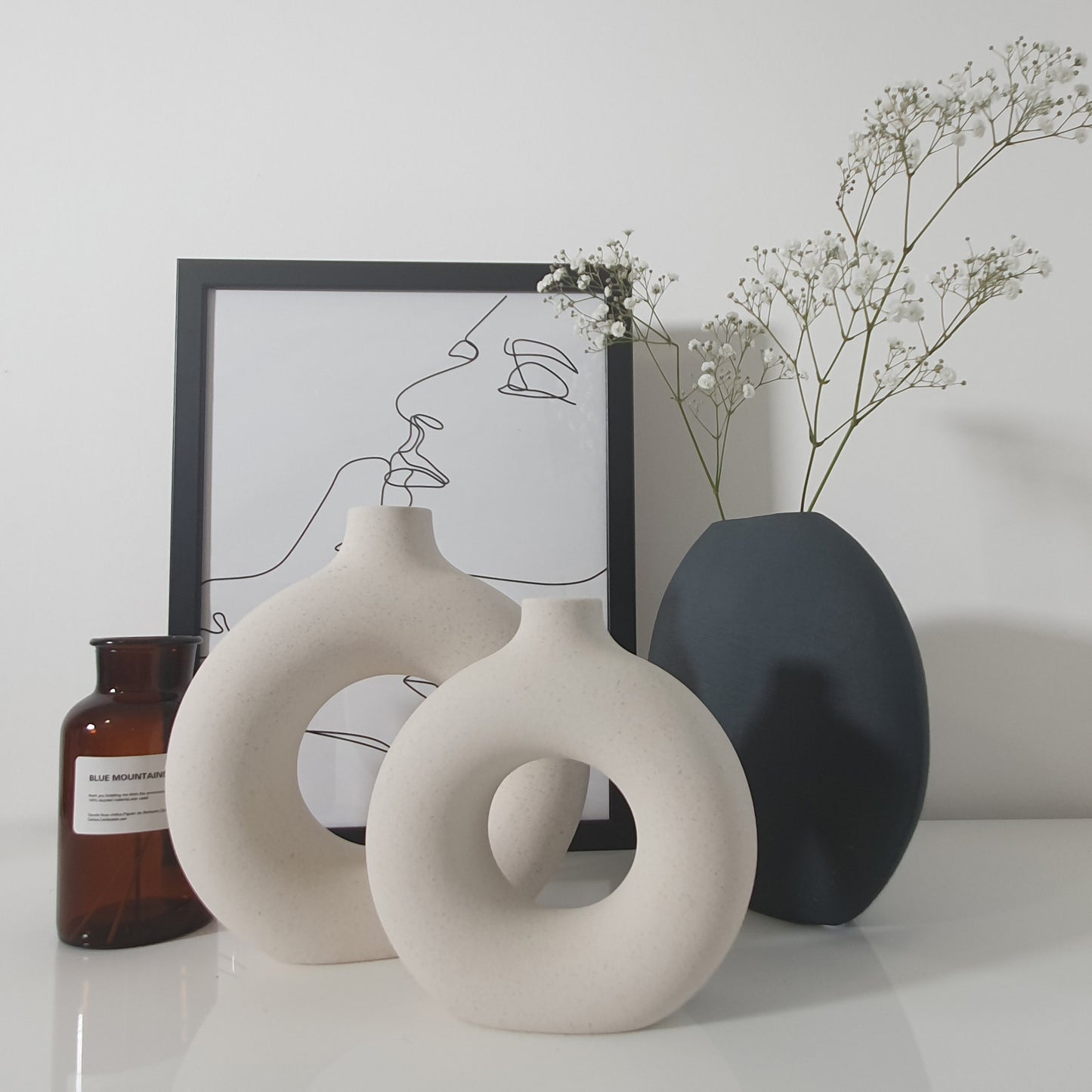 Dark green ceramic oval vase
