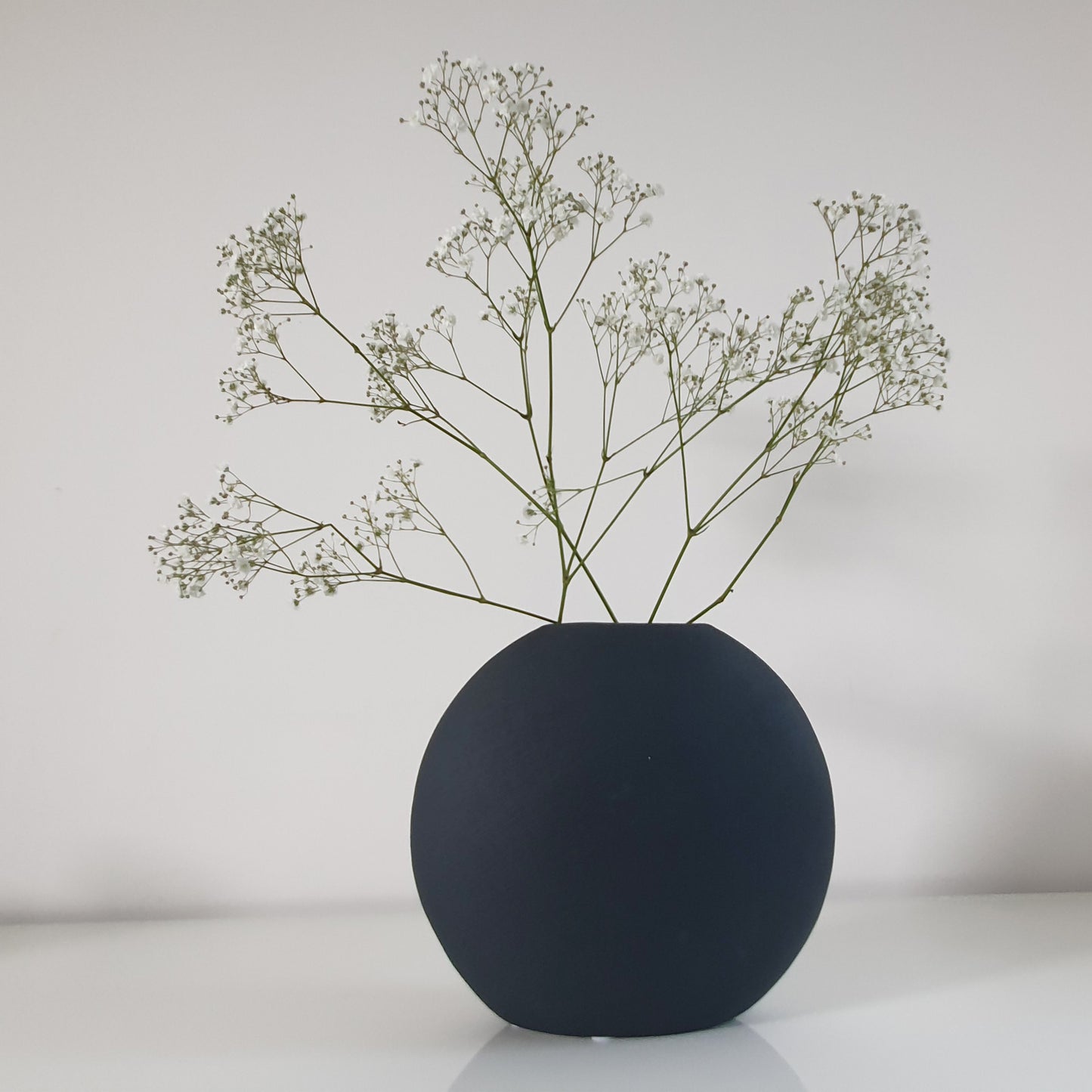 Dark green ceramic oval vase